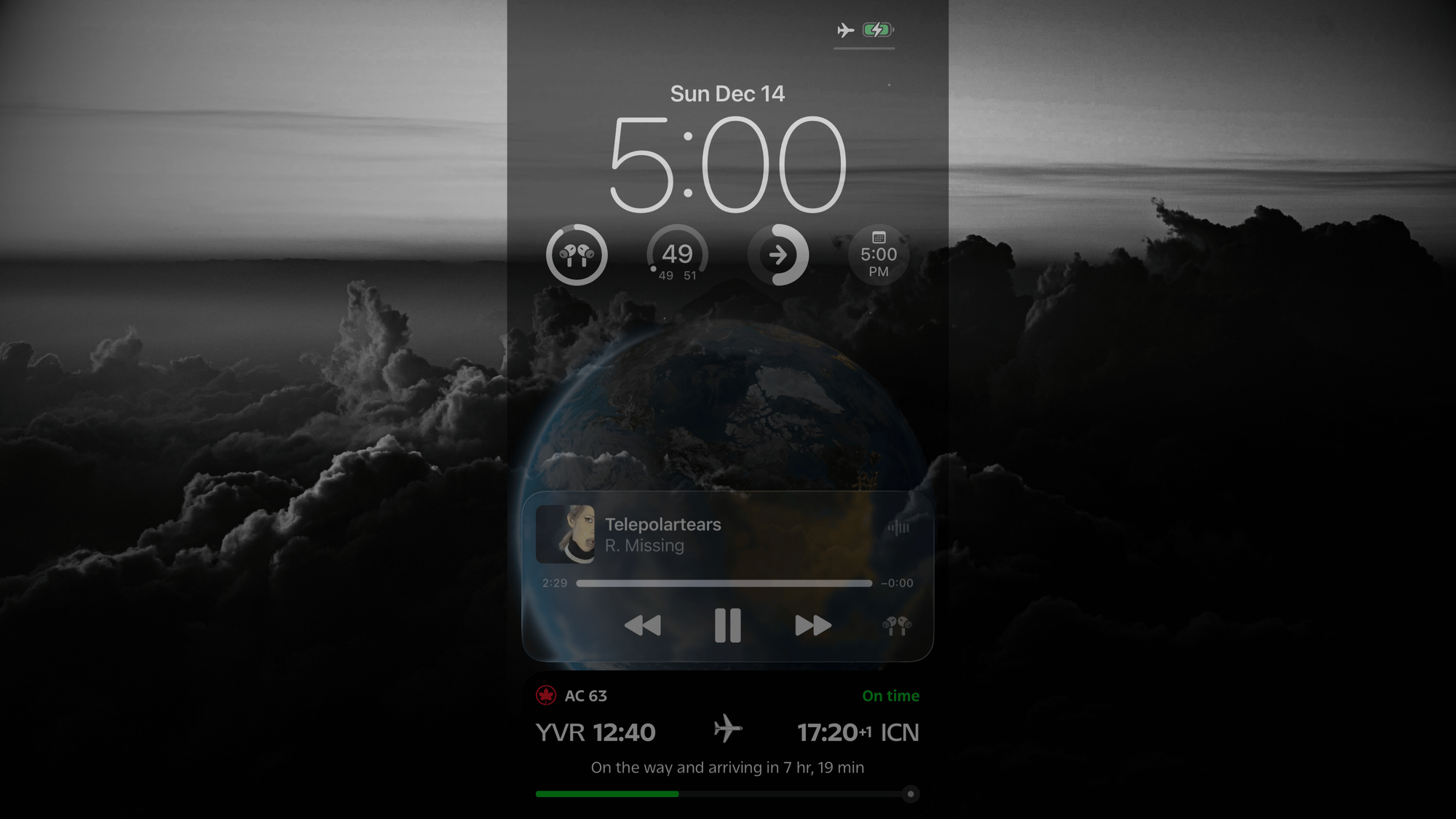 A screen shot of Dean Bowman's smart phone over an image of the sunset from the plane's window