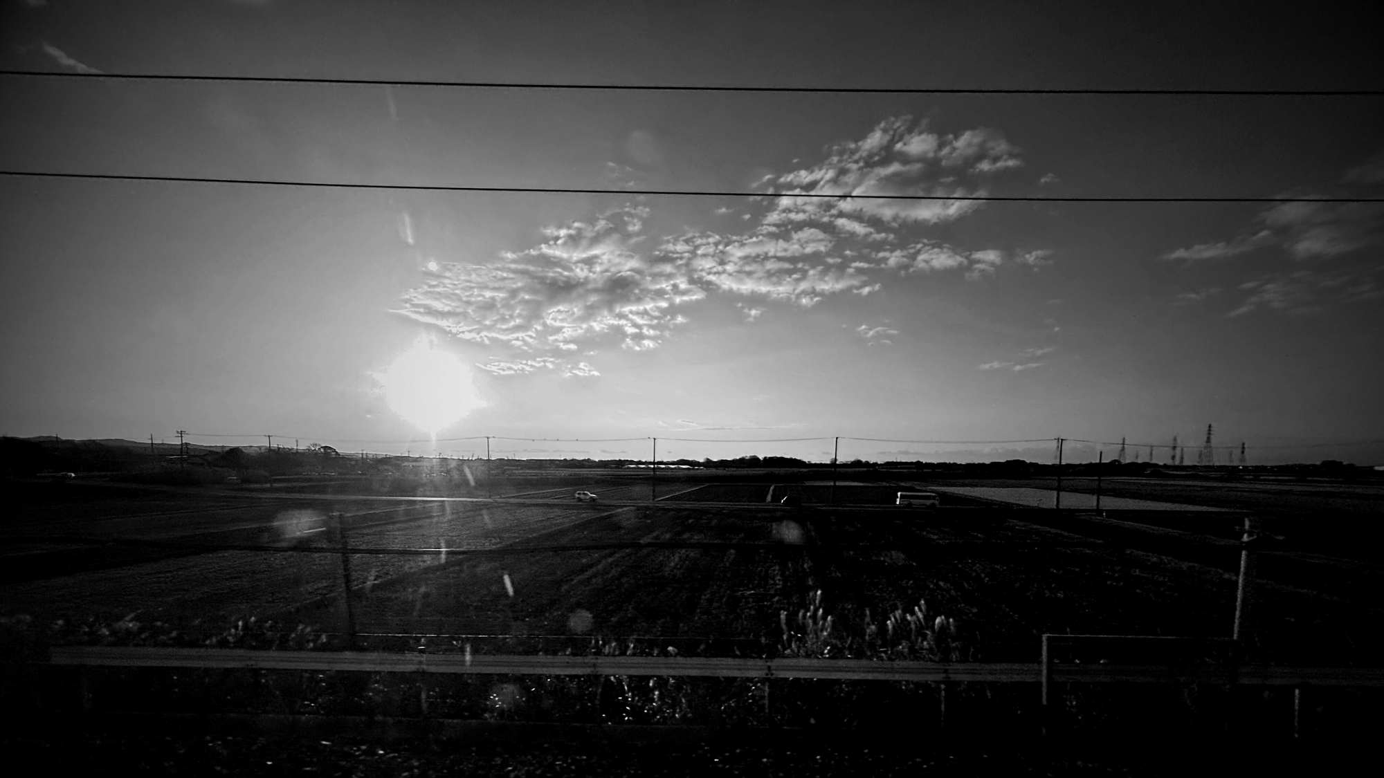 View of the sunrise from rail car 15 on the Nozomi number 59